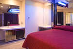 King size bed, vanity with Vegas bench and wet bar with refrigerator
