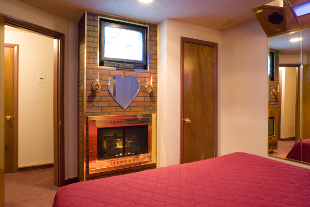 Color TV, fireplace and king sized regular bed