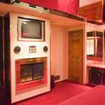 42" LCD flat screen TV, AM/FM stereo, fireplace, bubble column lights and wet bar with refrigerator